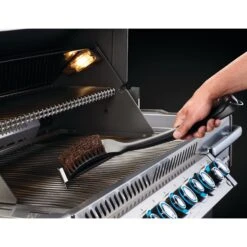 Napoleon Natural Fiber Grill Brush With Grid Scraper -BBQ Haven Shop Low Res JPG 62053 PalmyraCleaningBrush InUse Hook