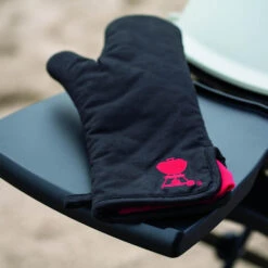 Weber Grills Black With Red Kettle Cotton Grill Glove With Extra Long Cuff -BBQ Haven Shop Weber Black with red kettle cotton grill glove resting on side shelf